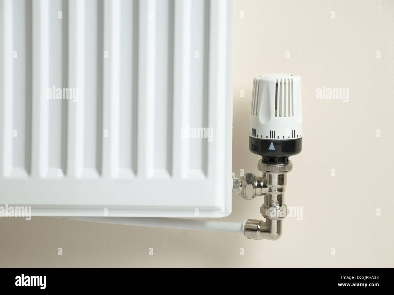 Corner of a domestic radiator, showing the temperature control valve ...