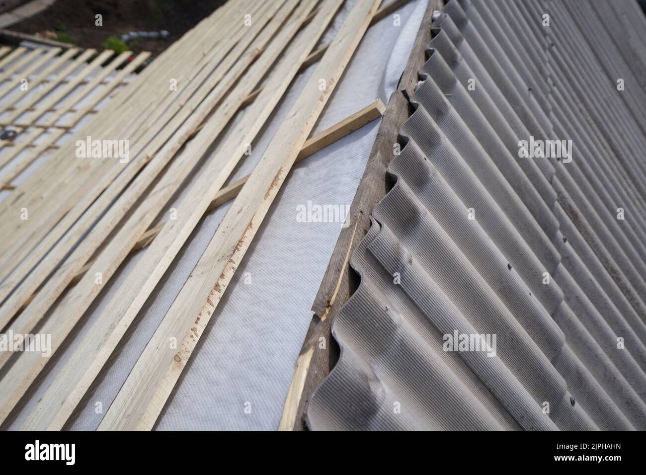 Roof construction and repairing old slate roof Stock Photo