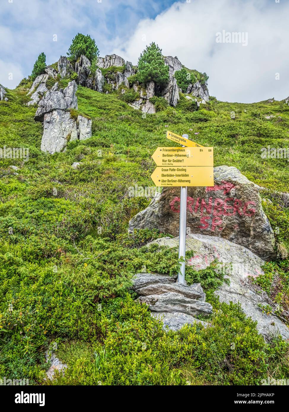 Route indicator sign at the Gams Hut mountain refuge managed by DAV Sektion Otterfing located near Mayrhofen on the Berliner Hoehenweg trail Stock Photo