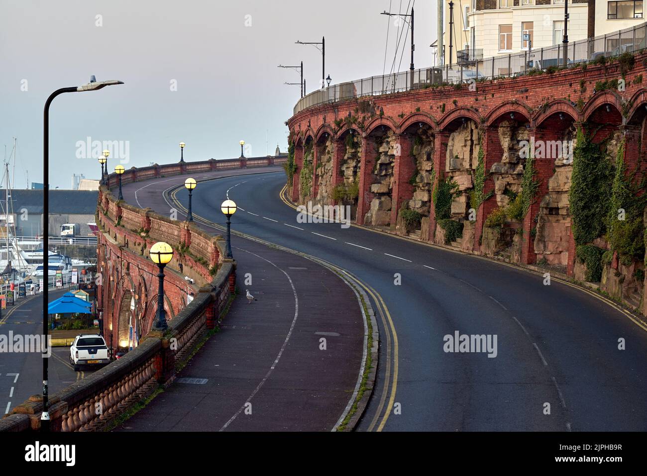 The road passing near the arches and balustrades of Royal Parade in Ramsgate, UK Stock Photo