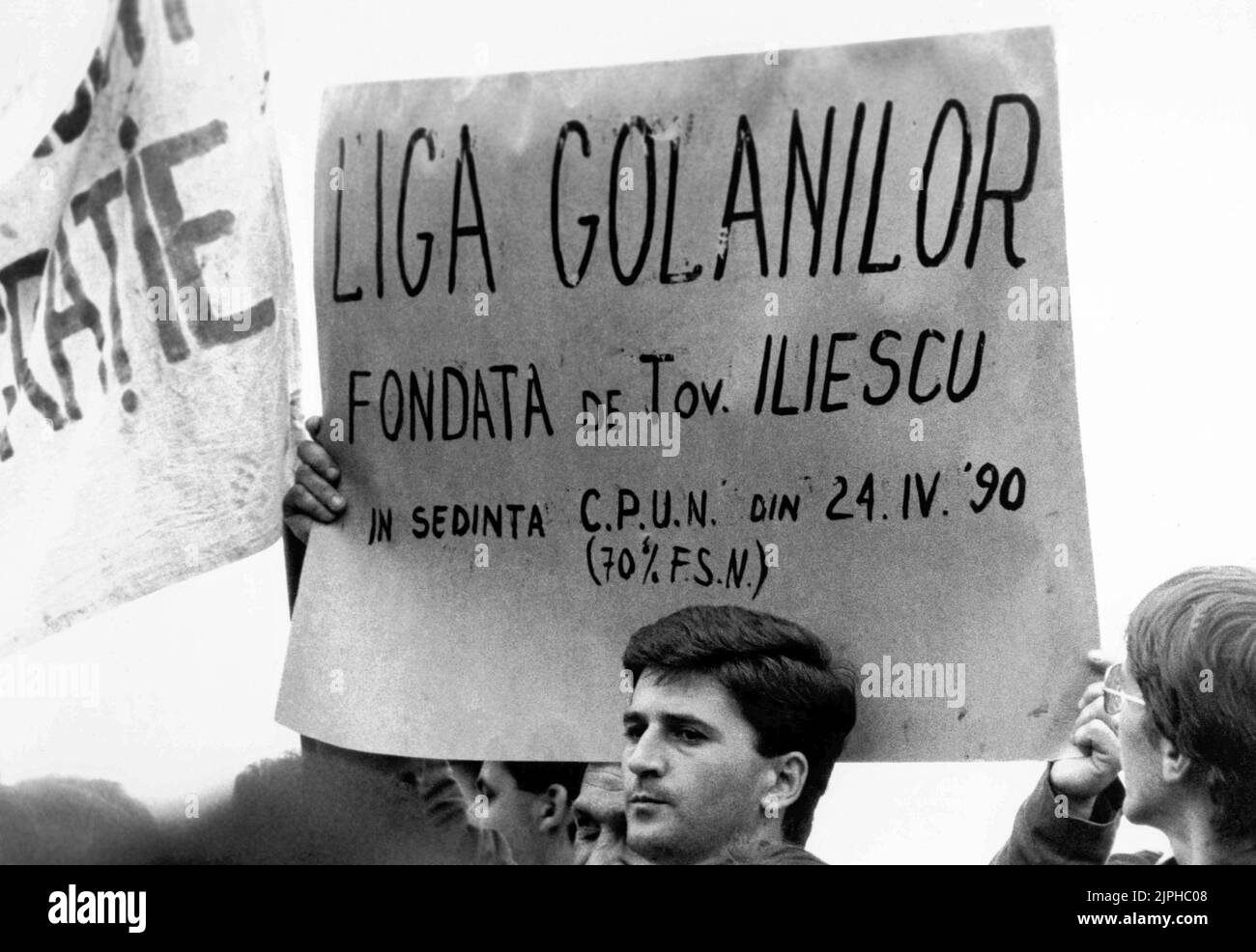 Bucharest, Romania, April 1990. 'Golaniada', a major anti-communism protest  in the University Square following the Romanian Revolution of 1989. People would gather daily to protest the ex-communists that grabbed the power after the Revolution. This banner says 'The Hooligans' League, founded by comrade Iliescu in April 24, 1990' Stock Photo