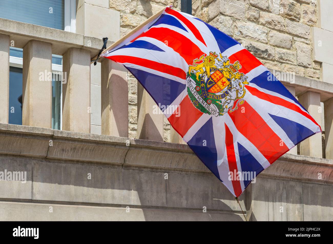 Dieu et mon droit Union Jack flag for the Queens Platinum Jubilee celebrations at Swanage, Dorset UK on a hot sunny day in June Stock Photo