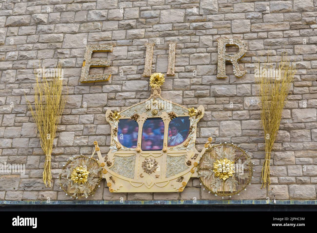 Queen's golden carriage on the side of Mowlem theatre for the Queens Platinum Jubilee celebrations at Swanage, Dorset UK on a hot sunny day in June Stock Photo