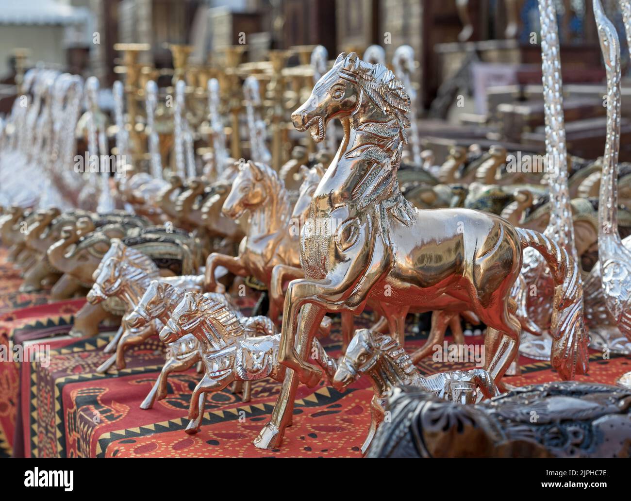 Brass figurines of a horses in an Indian shop window. Souvenirs from