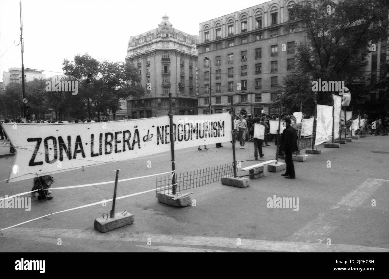 Bucharest, Romania, April 1990. 'Golaniada', a major anti-communism protest  in the University Square following the Romanian Revolution of 1989. People would gather daily to protest the ex-communists that grabbed the power after the Revolution. The protesters occupied and enclosed a large area in the University Square. The banner says 'Romania's neo-communism free zone'. Stock Photo
