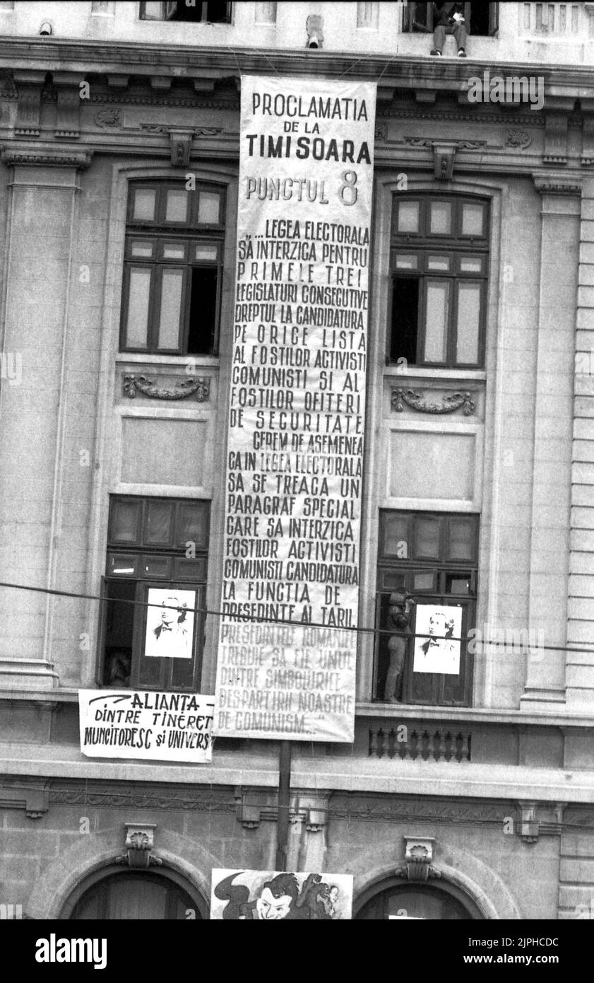 Bucharest, Romania, April 1990. 'Golaniada', a major anti-communism protest  in the University Square following the Romanian Revolution of 1989. People would gather daily to protest the ex-communists that grabbed the power after the Revolution. The main demand was that no former party member would be allowed to run in the elections of May 20th, as stated in the large banner in the University building. Stock Photo