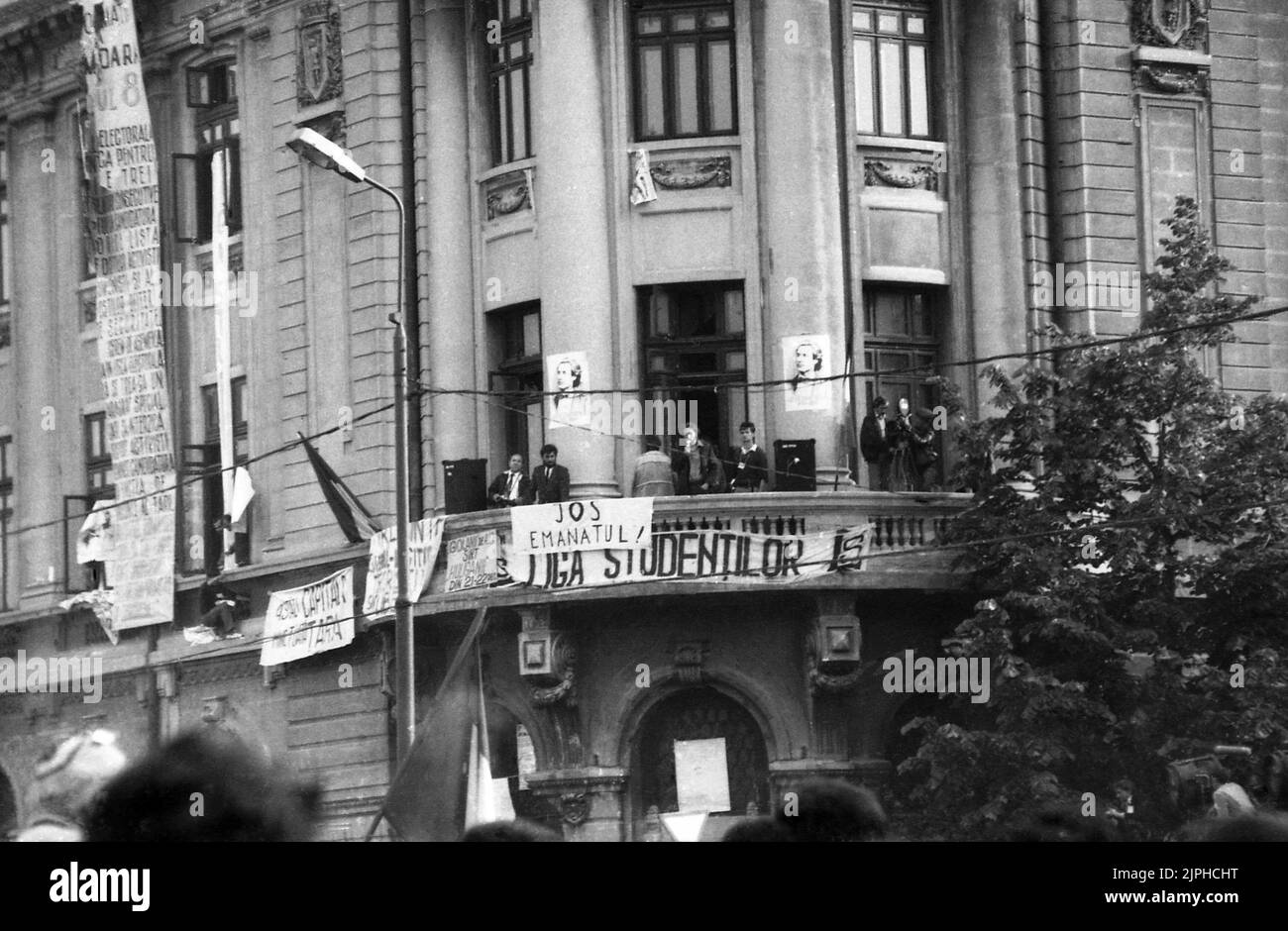 Bucharest, Romania, April 1990. 'Golaniada', a major anti-communism protest in the University Square following the Romanian Revolution of 1989. People would gather daily to protest the ex-communists that grabbed the power after the Revolution. The balcony of the University building became 'the platform for democracy', used to address the crowd. Stock Photo