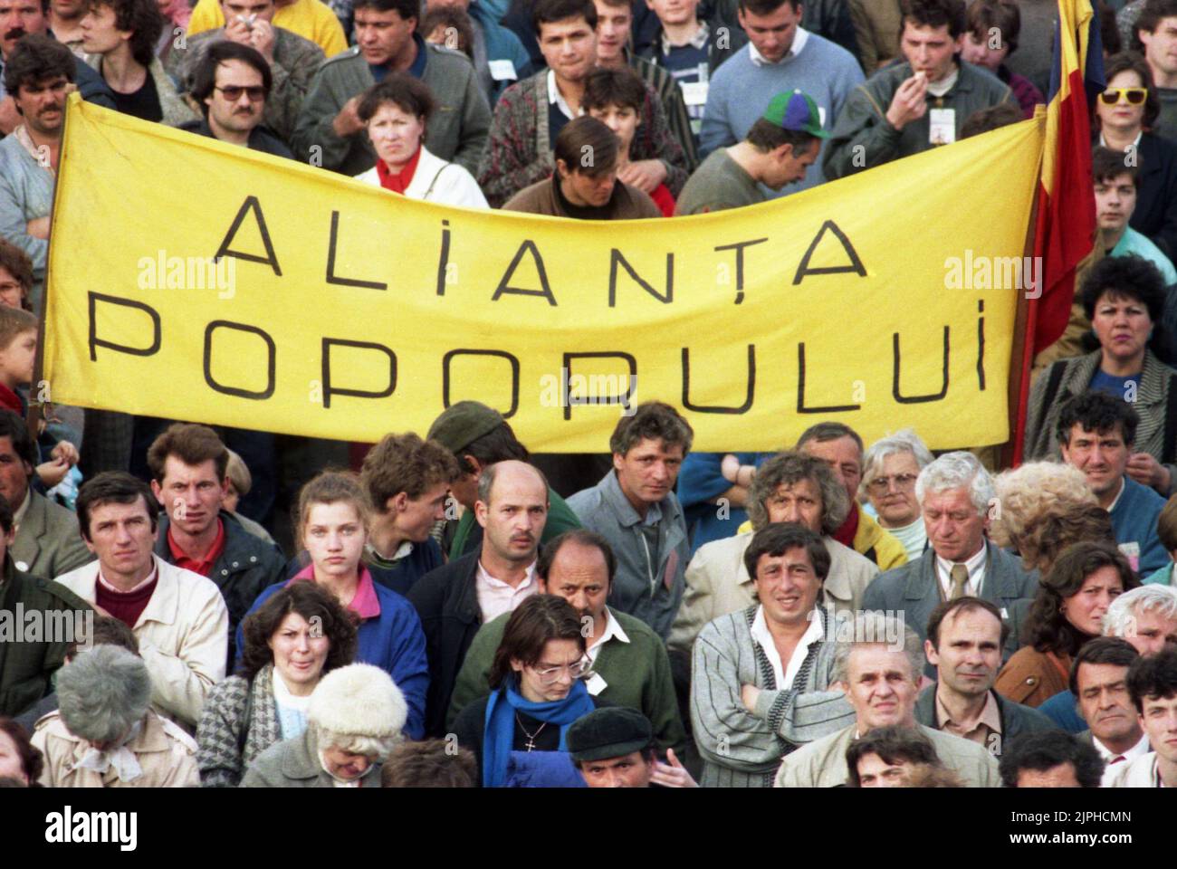 Bucharest, Romania, April 1990. 'Golaniada', a major anti-communism protest  in the University Square following the Romanian Revolution of 1989. People would gather daily to protest the ex-communists that grabbed the power after the Revolution. The main demand was that no former party member would be allowed to run in the elections of May 20th. The banner says 'The people's alliance'. Stock Photo