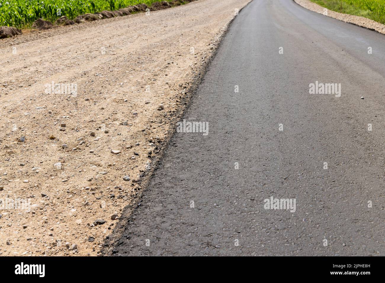 paved road for car traffic, construction of a new paved road for