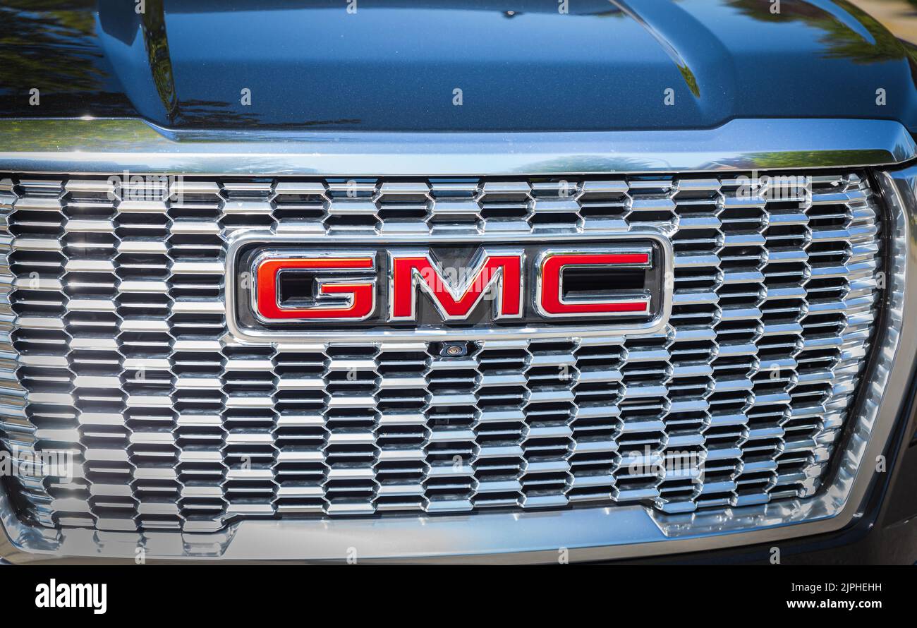 The new luxury GMC with all black details. GMC truck on display. Custom black GMC Sierra Denali front grill with company logo-Nobody, selective focus, Stock Photo