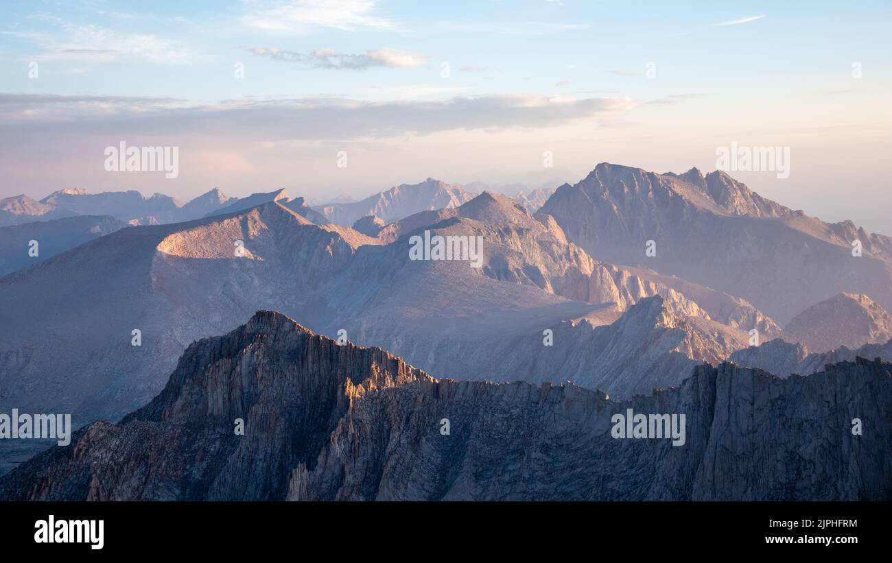A mesmerizing view of a golden sunset over mountains Stock Photo - Alamy
