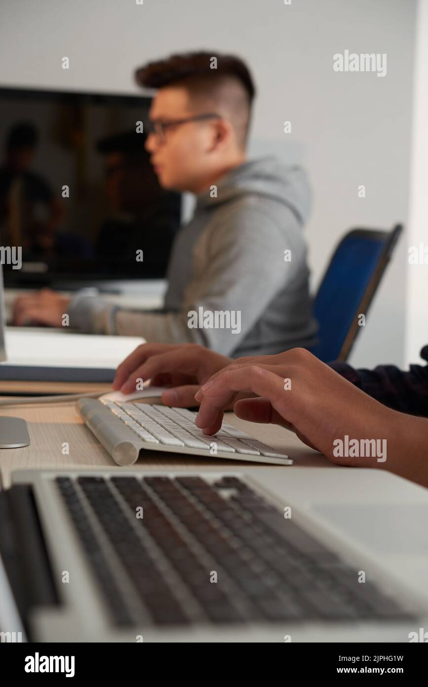 Group of university students using modern computers while having ICT class Stock Photo