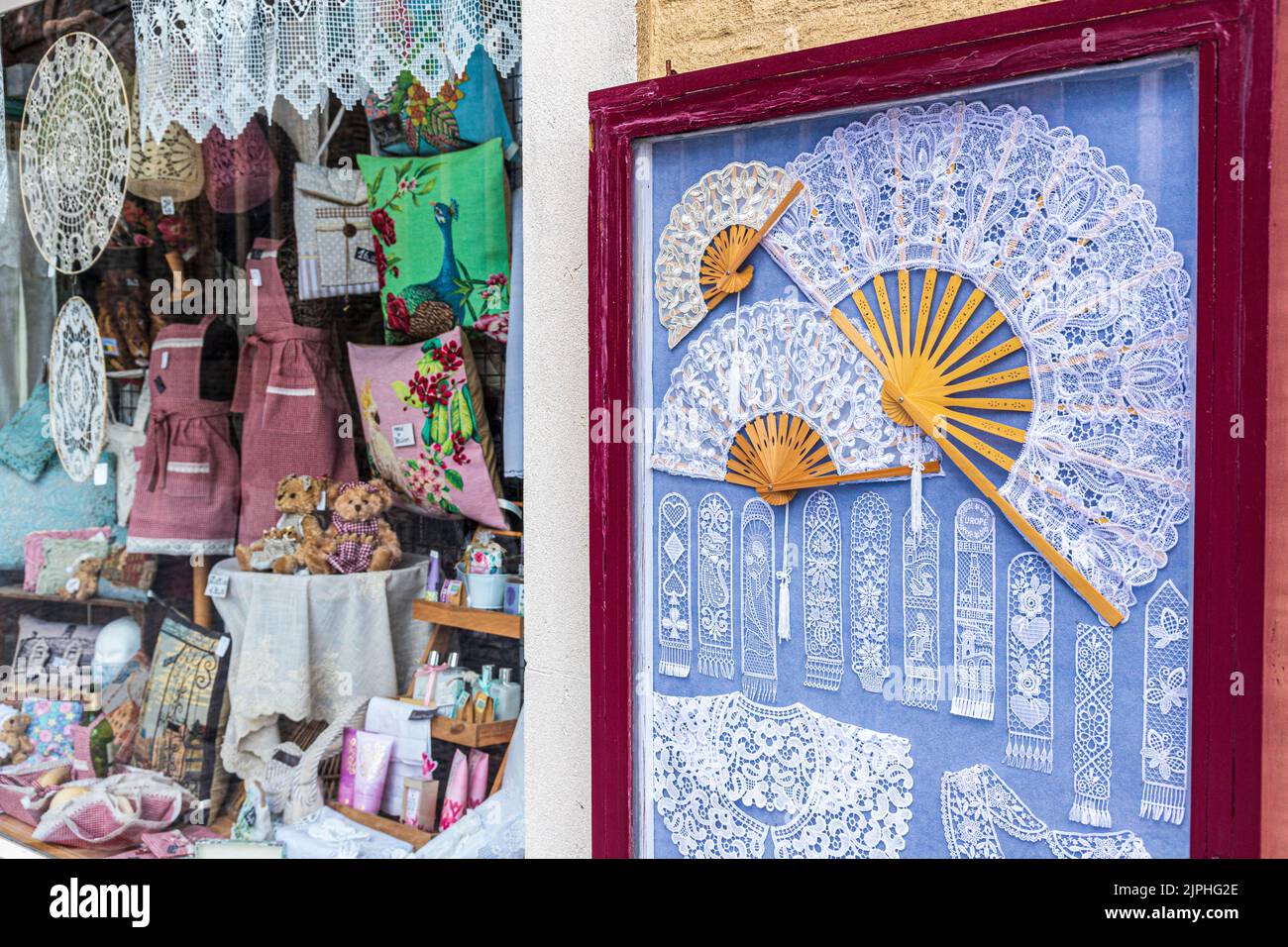 Belgian lace on display outside a shop in Bruges, Belgium Stock Photo