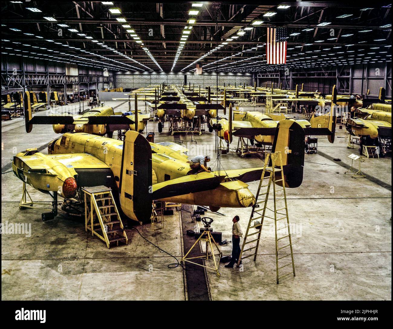 WW2 BOMBER AIRCRAFT PRODUCTION North American B-25 Mitchell production in Kansas City in 1942 Assembling the North American B-25 Mitchell at Kansas City, Kansas (USA)  The North American B-25 Mitchell was an American medium bomber that was introduced in 1941 and named in honor of Major General William 'Billy' Mitchell, a pioneer of U.S. military aviation. Used by many Allied air forces, the B-25 served in every theater of World War II Stock Photo