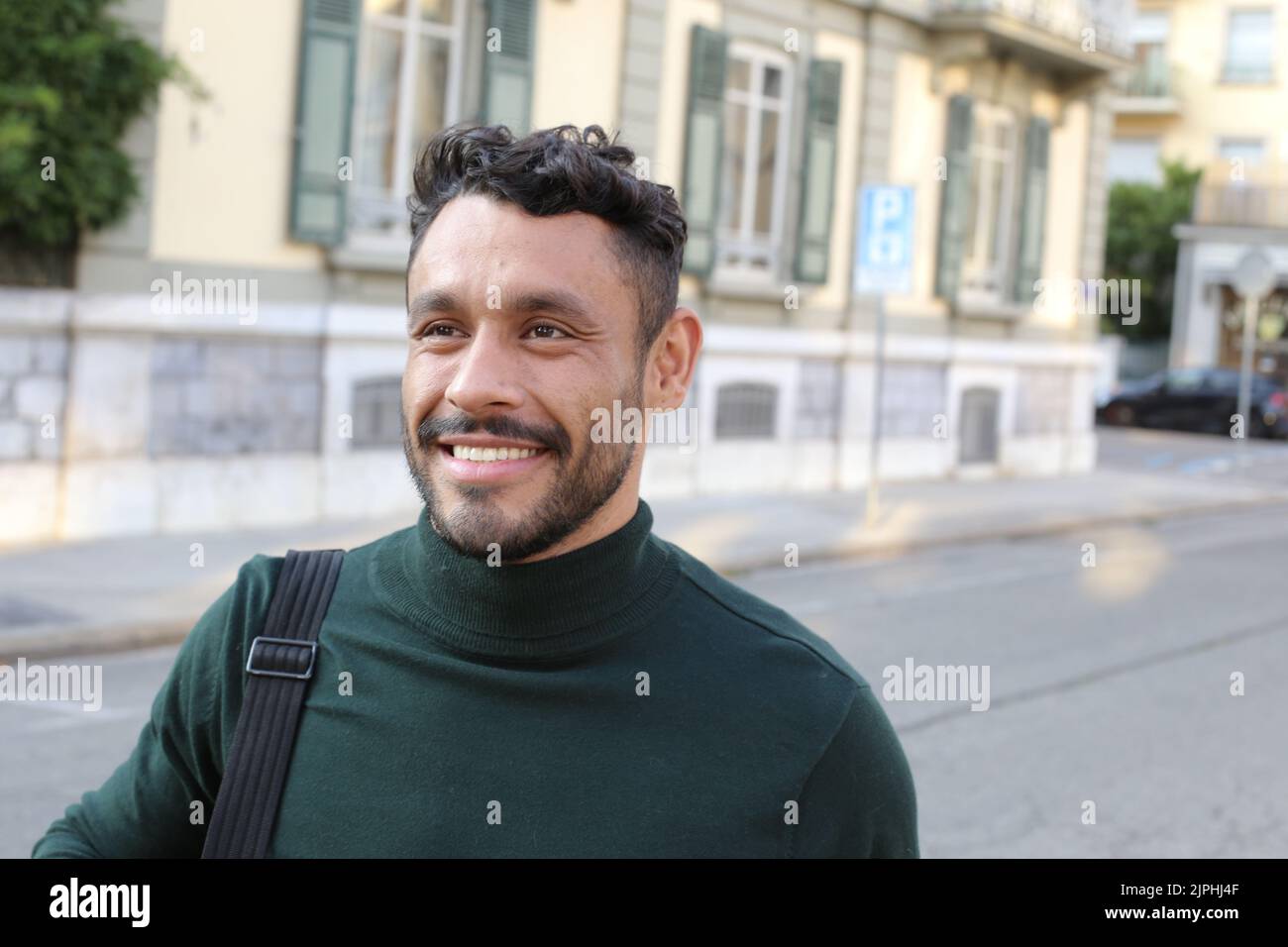 Handsome entrepreneur walking around with elegant turtle neck shirt Stock Photo