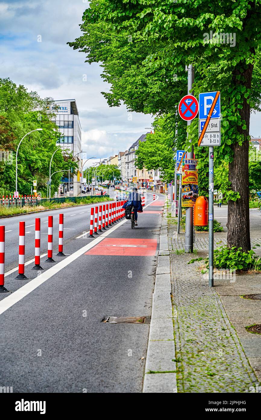 Berlin, Germany - May 29, 2022: Cyclist in a protected bike lane on a ...