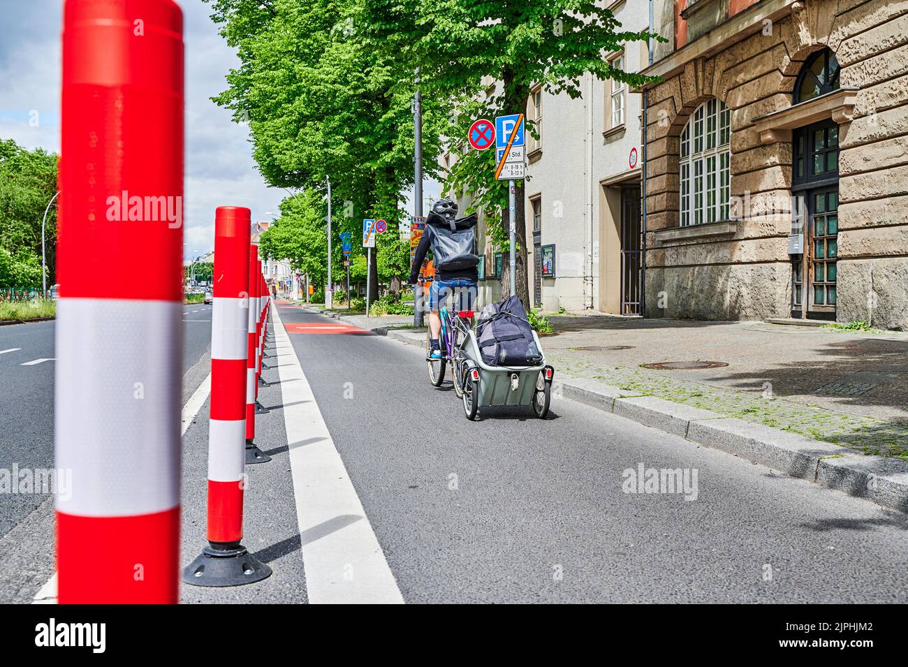 Berlin, Germany - May 29, 2022: Cyclist in a protected bike lane on a ...