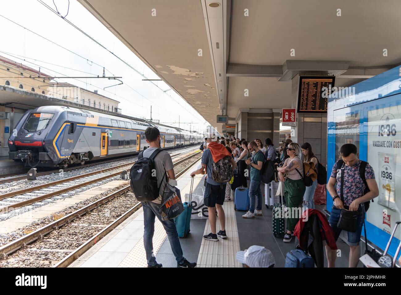 The Bologna train station with people during rush hours Stock Photo