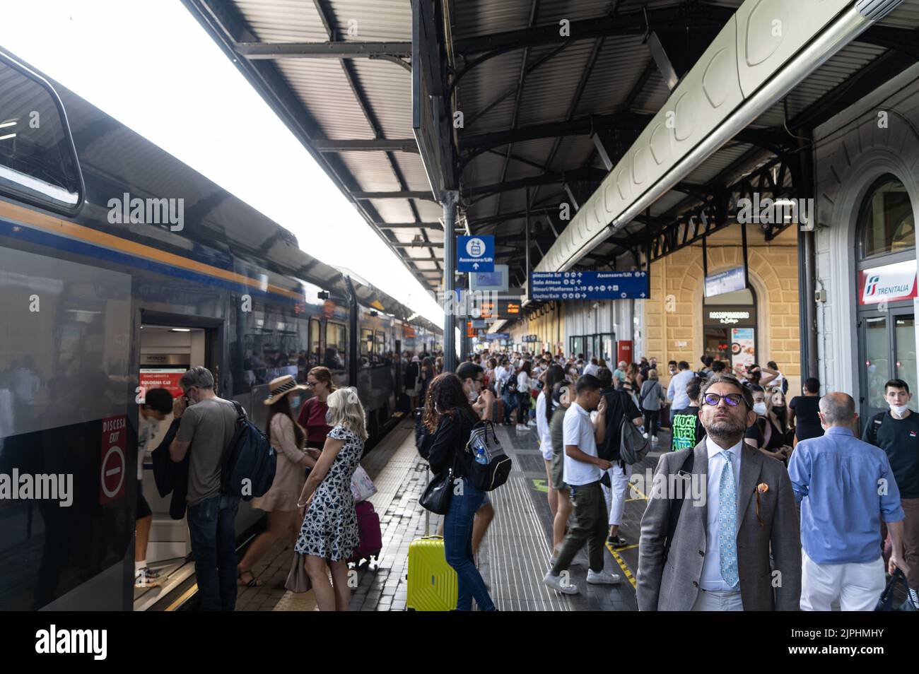 The Bologna train station with people during rush hours Stock Photo