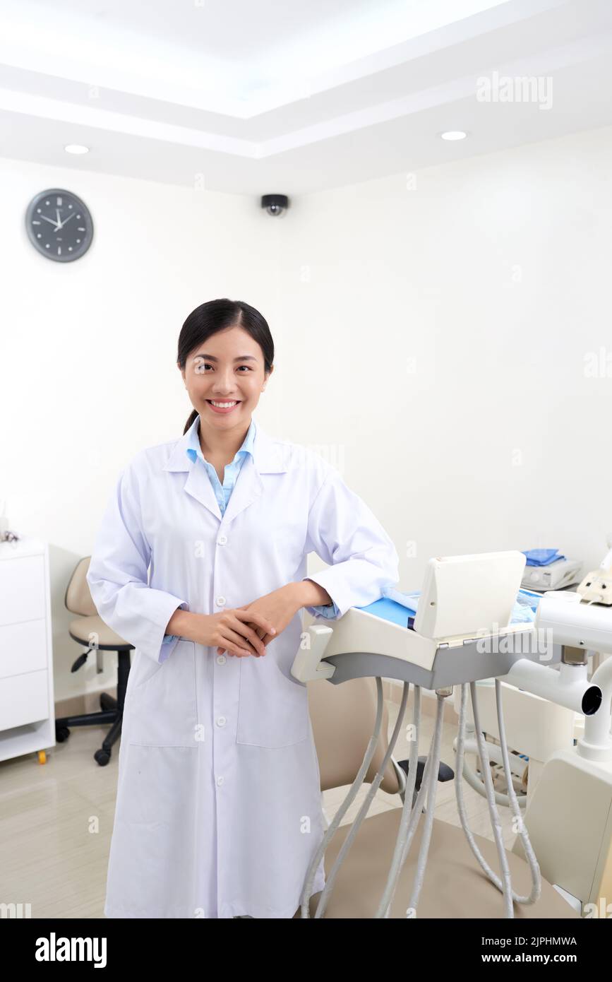 Pretty Vietnamese female dentist in her medical office Stock Photo Alamy