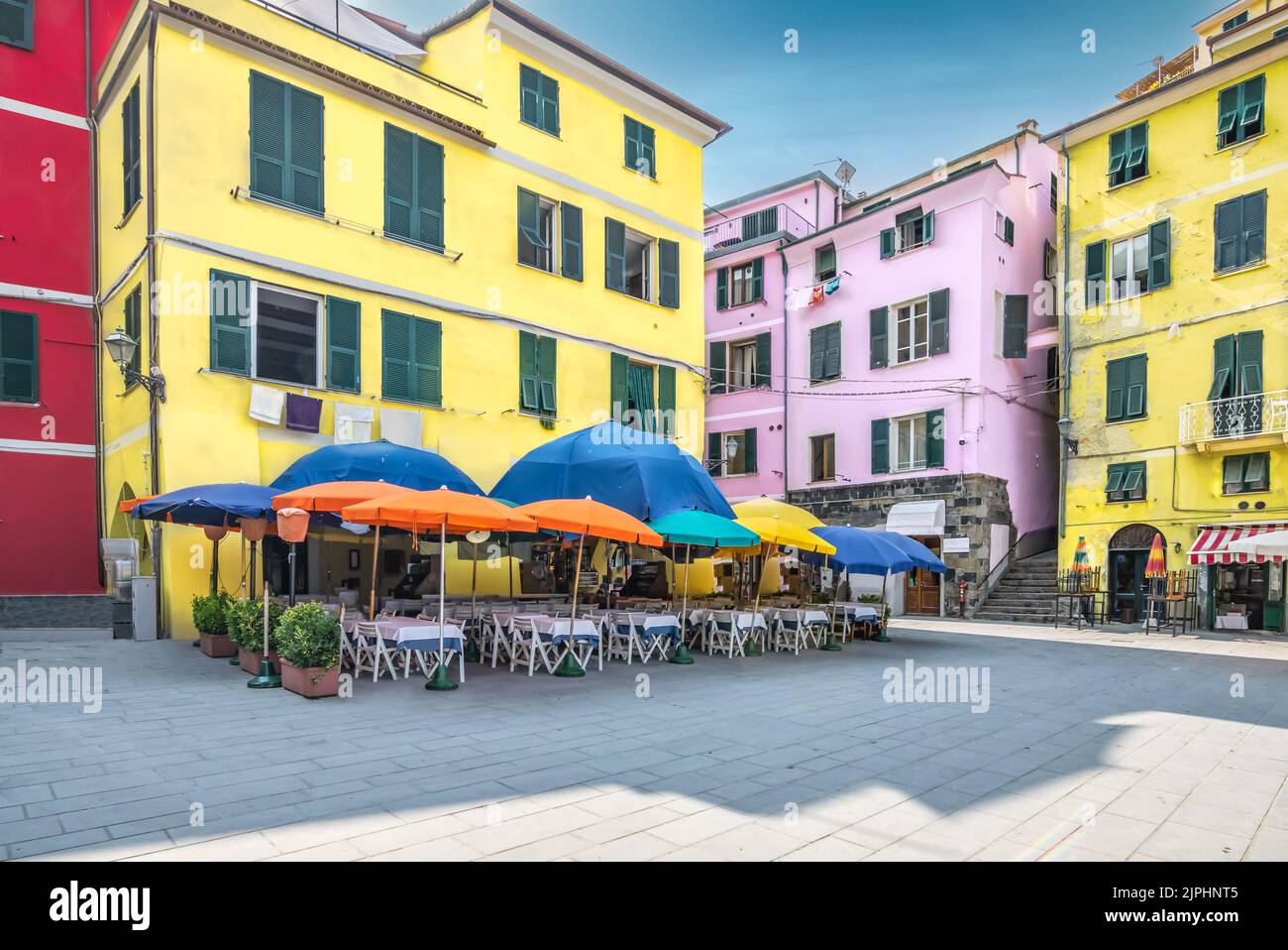 Colorful terrace umbrellas on town square, Vernazza, Cinque Terre, Italy. Stock Photo