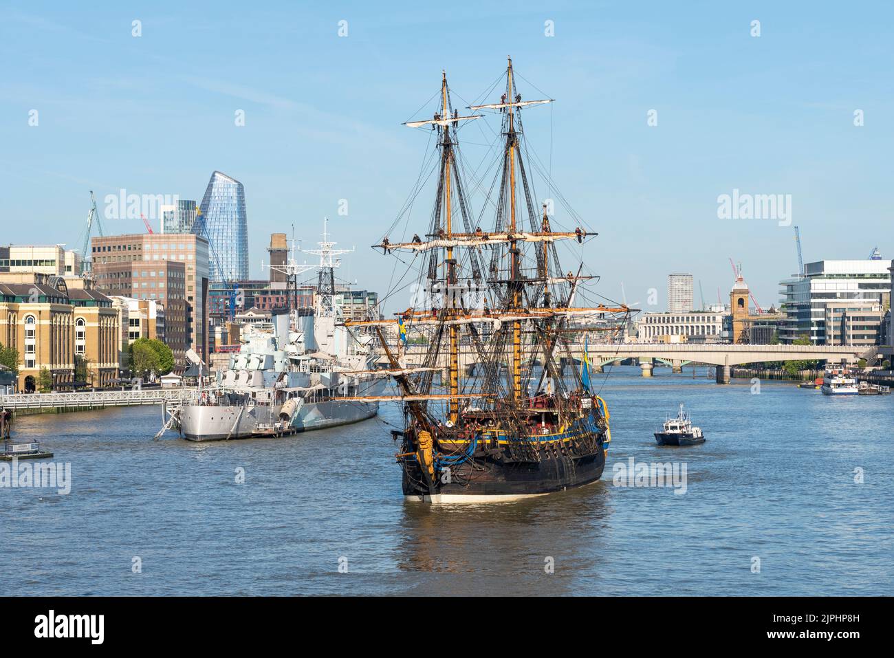 Gotheborg of Sweden, sailing replica of the Swedish East Indiaman Gotheborg I, visiting London, UK. London city skyline and HMS Belfast Stock Photo
