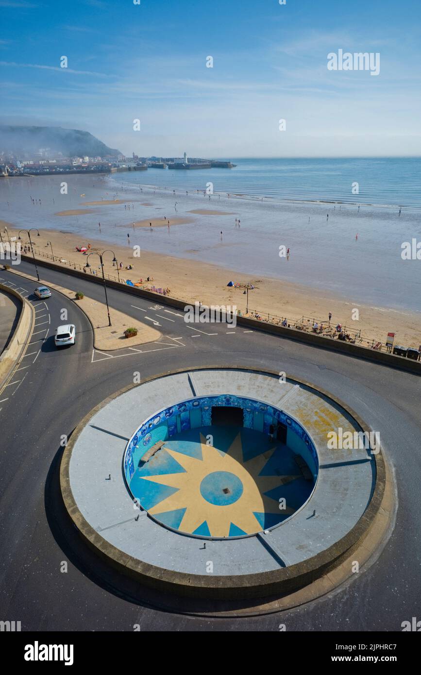 Looking down on subway and roundabout with beach in background Stock Photo