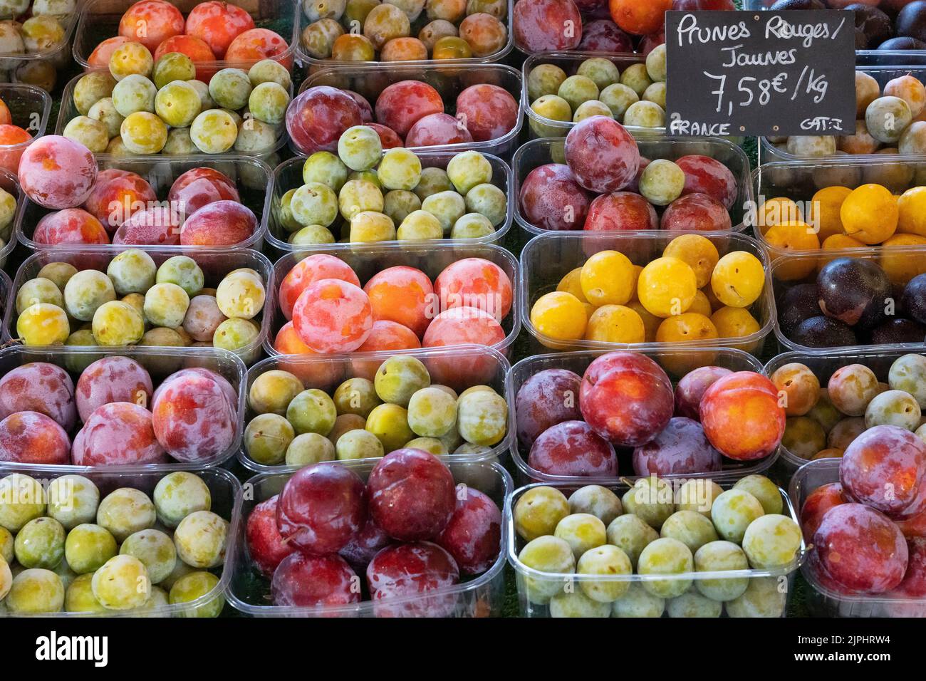 Plums stall in the market of Sanary-sur-mer, France Stock Photo