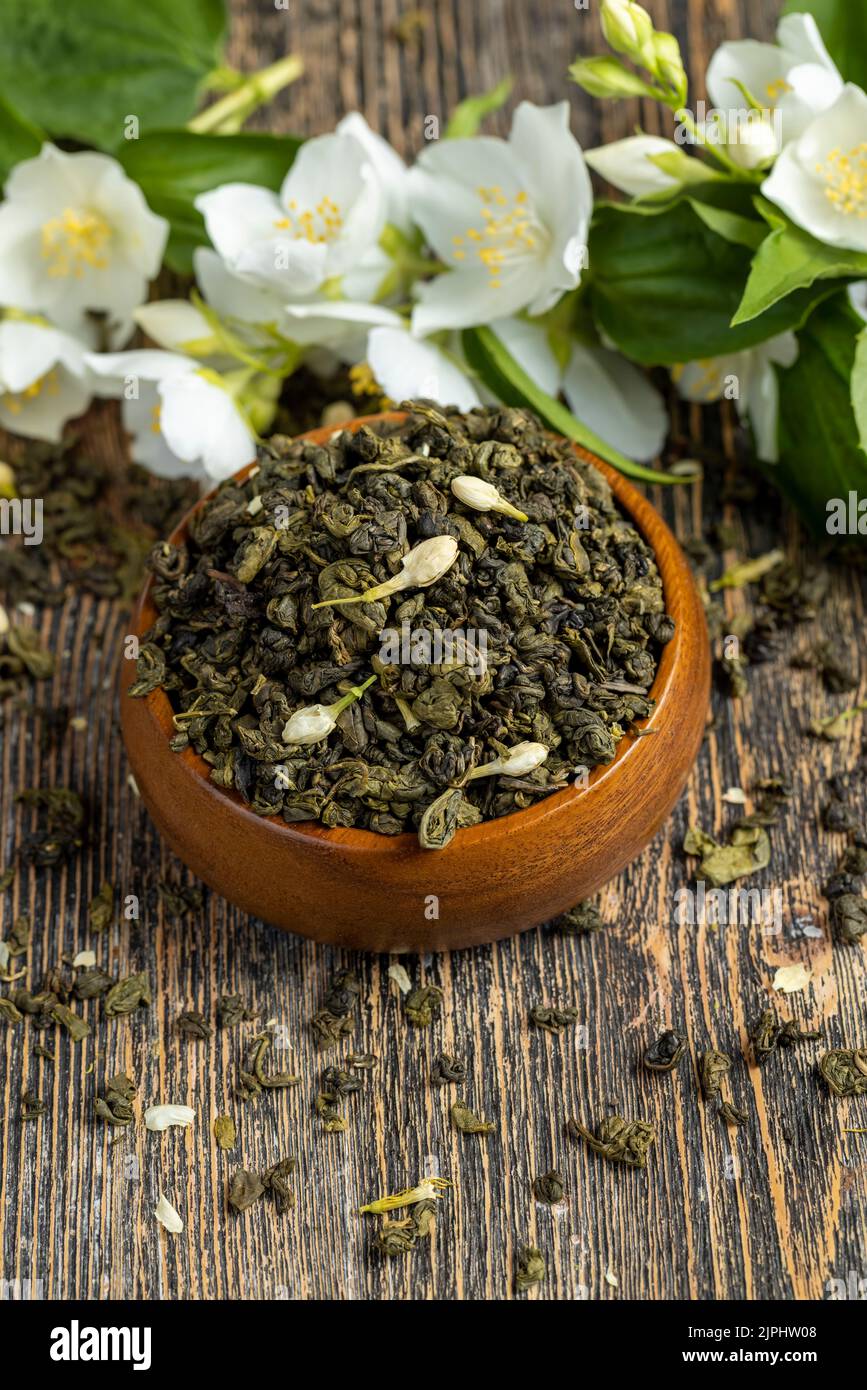 A real green hour with jasmine on the table, dried tea leaf for brewing
