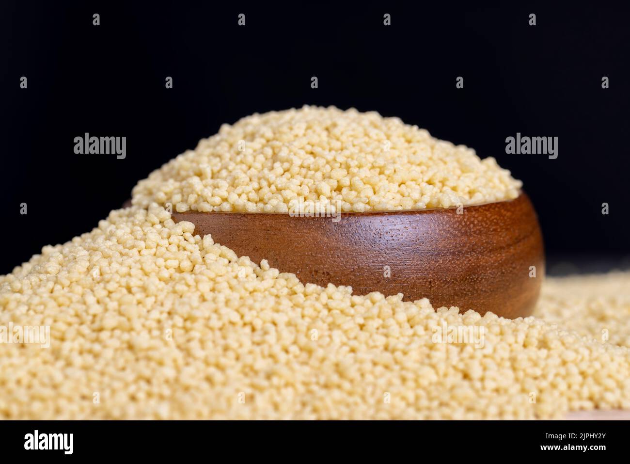Fresh raw porridge couscous from wheat or millet, cooking dishes from traditional cereals of