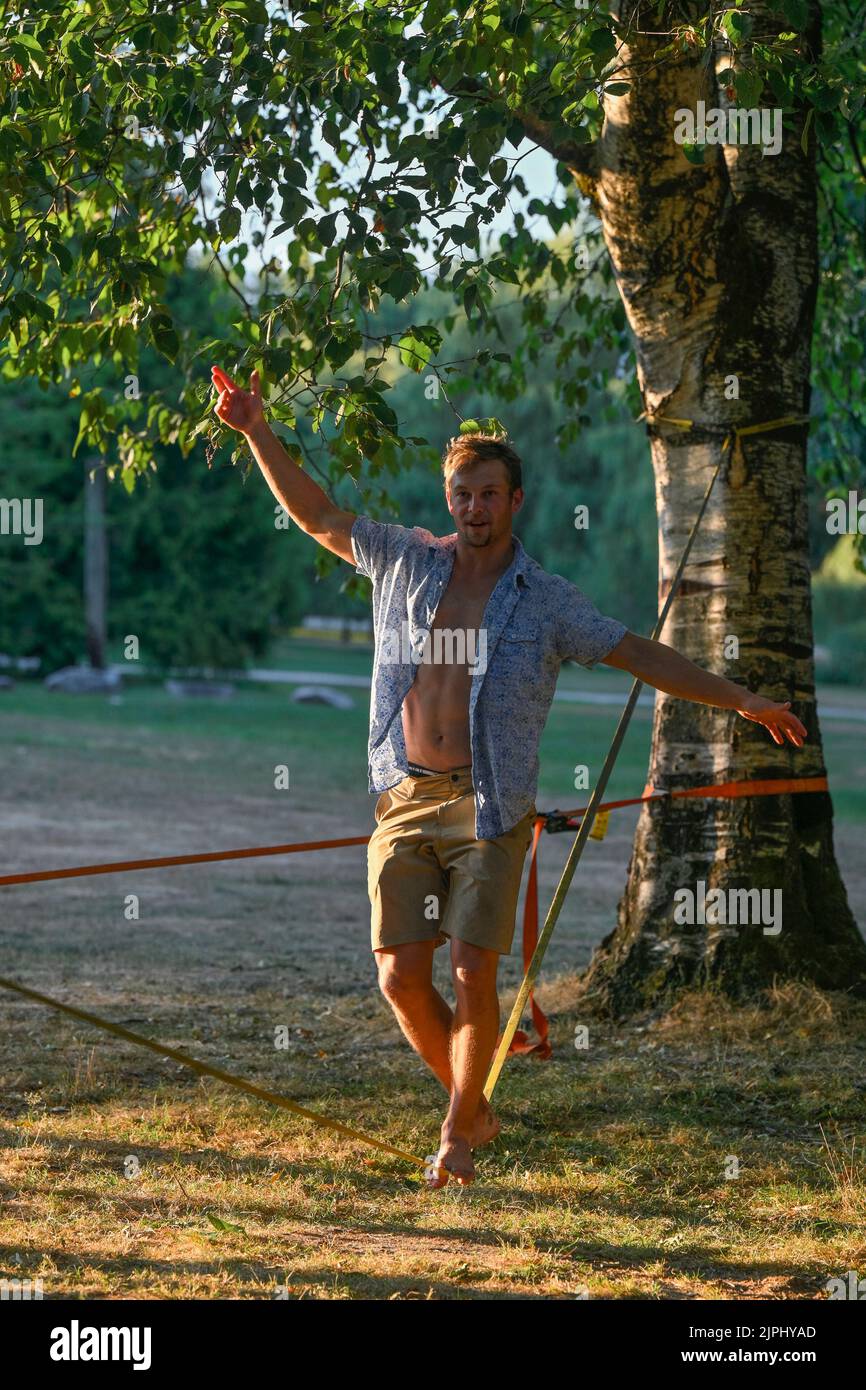 Slackline walker, John Hendry Park, Vancouver, British Columbia, Canada