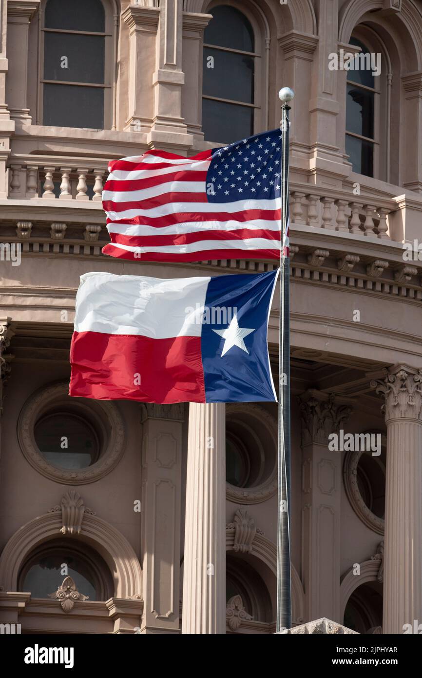 The United States flag and the Texas flag fly from the south entrance