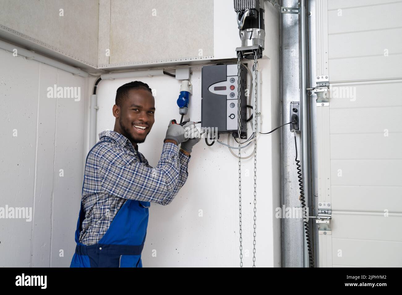 Installing Automatic Garage Door Or Gate. Maintenance And Repair Stock