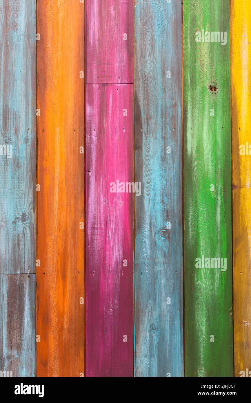 Vertical full frame background of vibrant and multi colored wooden planks with copy space Stock Photo