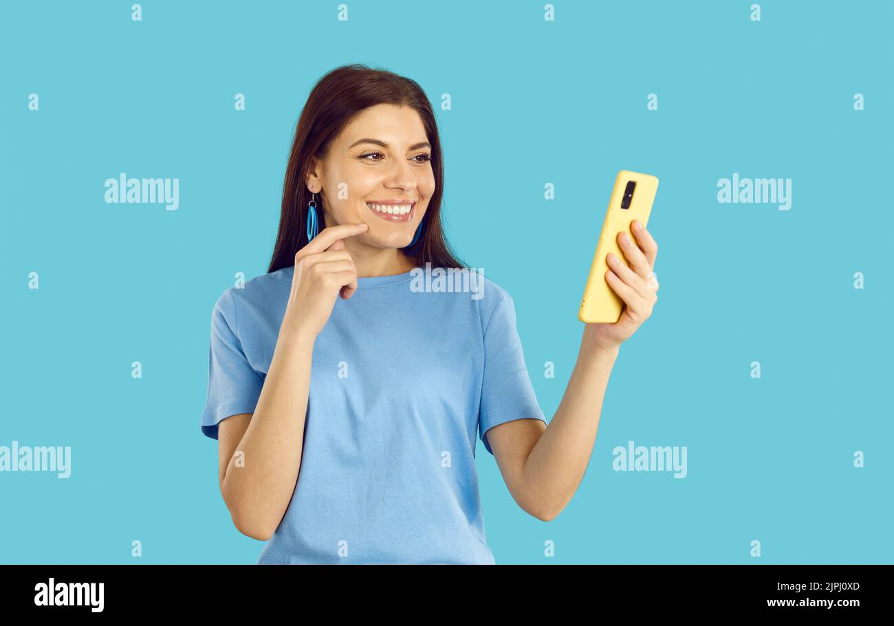 Happy girl use smartphone talking on video call Stock Photo - Alamy