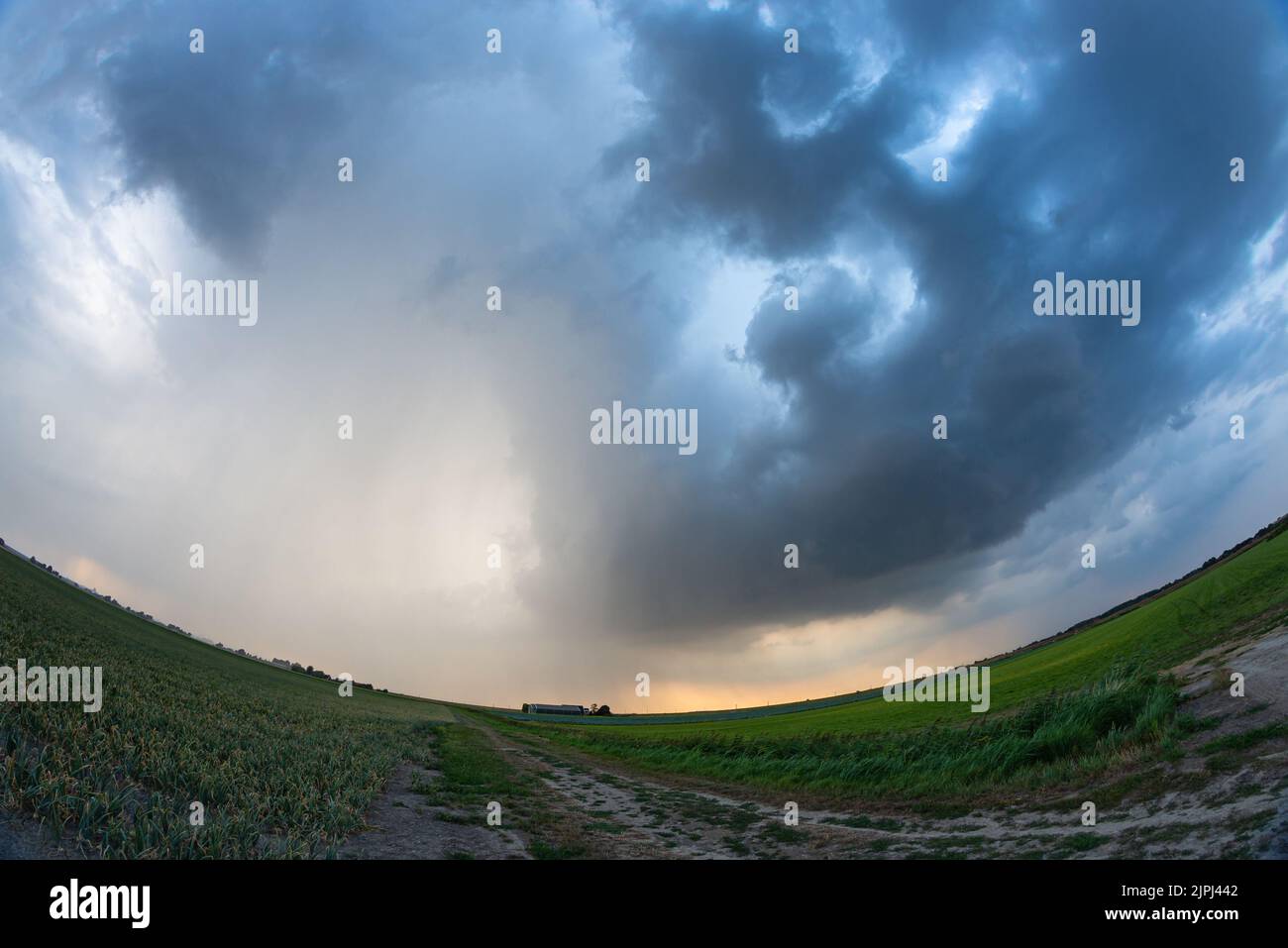 Fisheye view of a dramatic looking thunderstorm over the plains Stock Photo