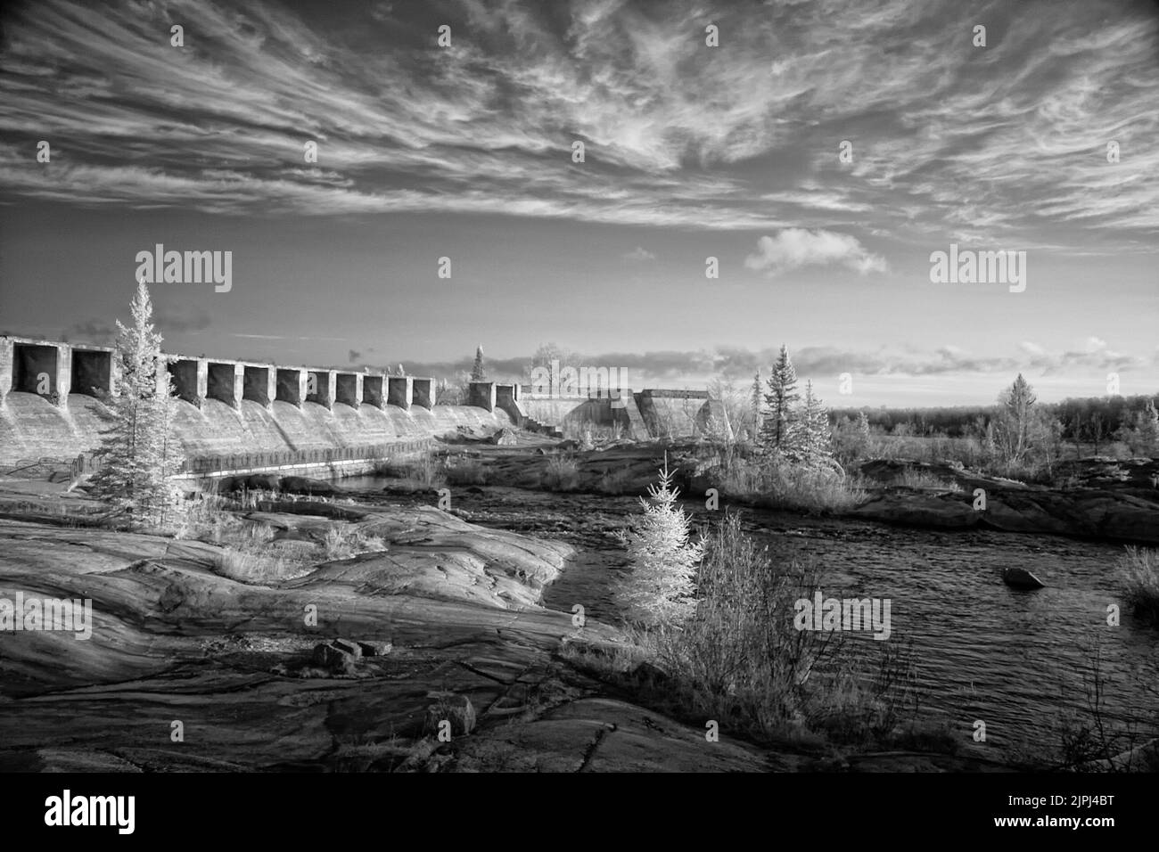 Pinawa Bridge An infrared shot of a bridge and a river in Pinawa Dam Provincial ...