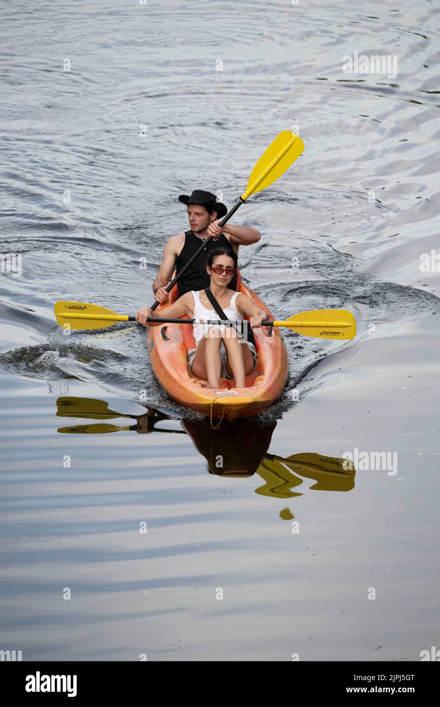 Austin Texas USA, August 14, 2022 Two people paddling in a kayak enjoy