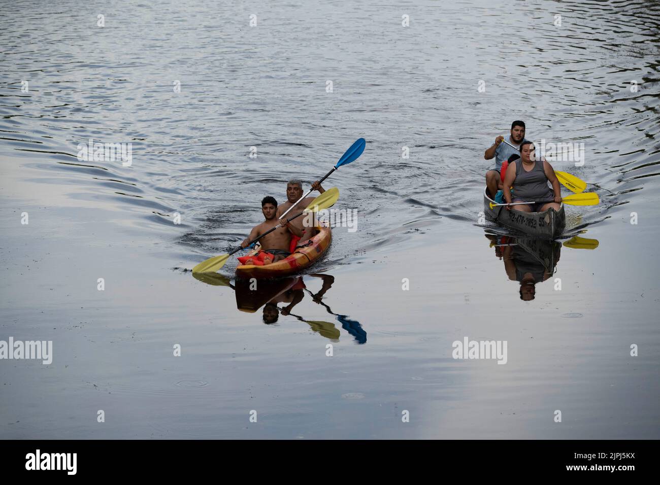 Austin Texas USA, August 14, 2022 People paddling in double kayaks