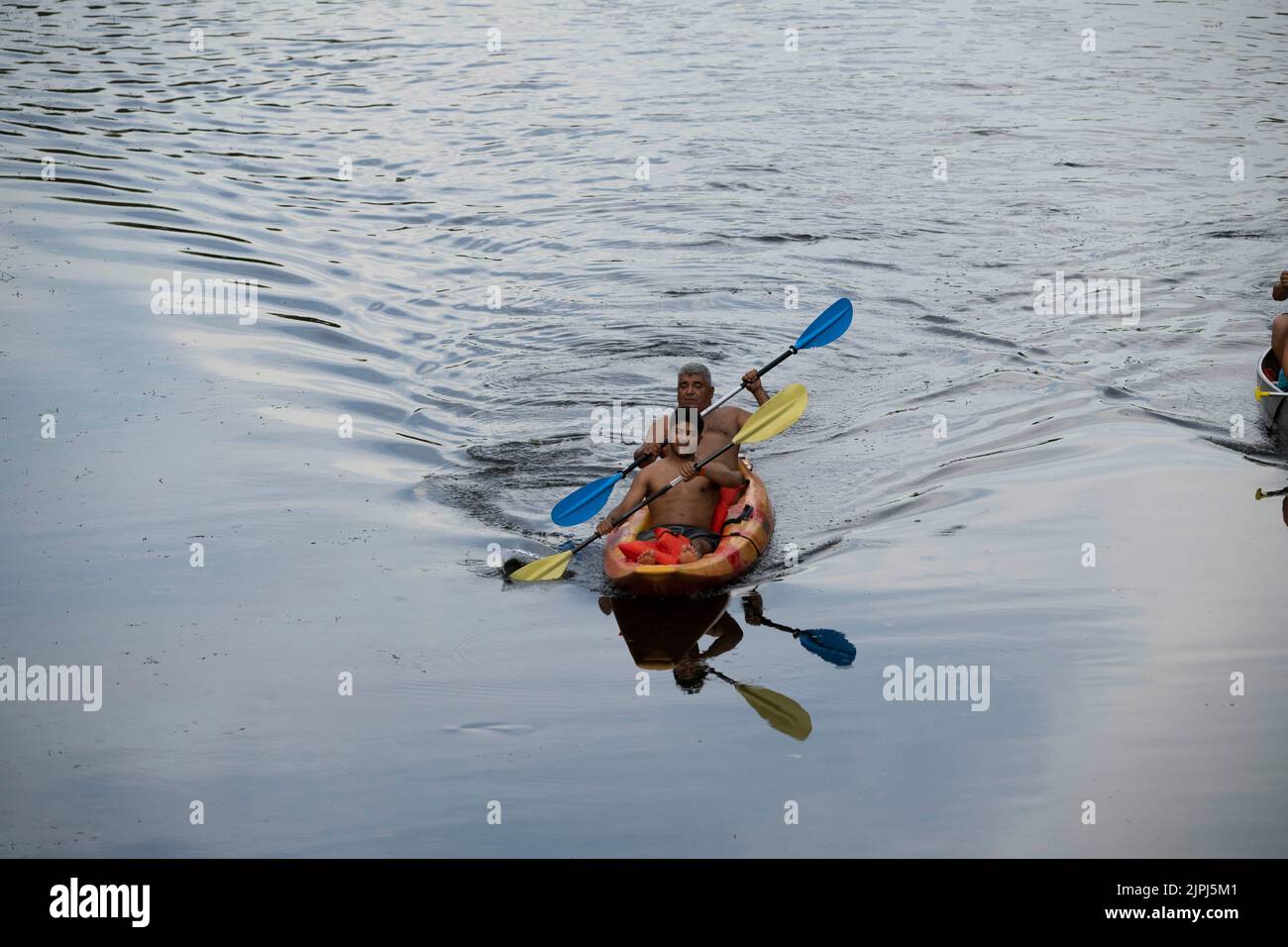 Austin Texas USA, August 14, 2022 Two people paddling in a kayak enjoy