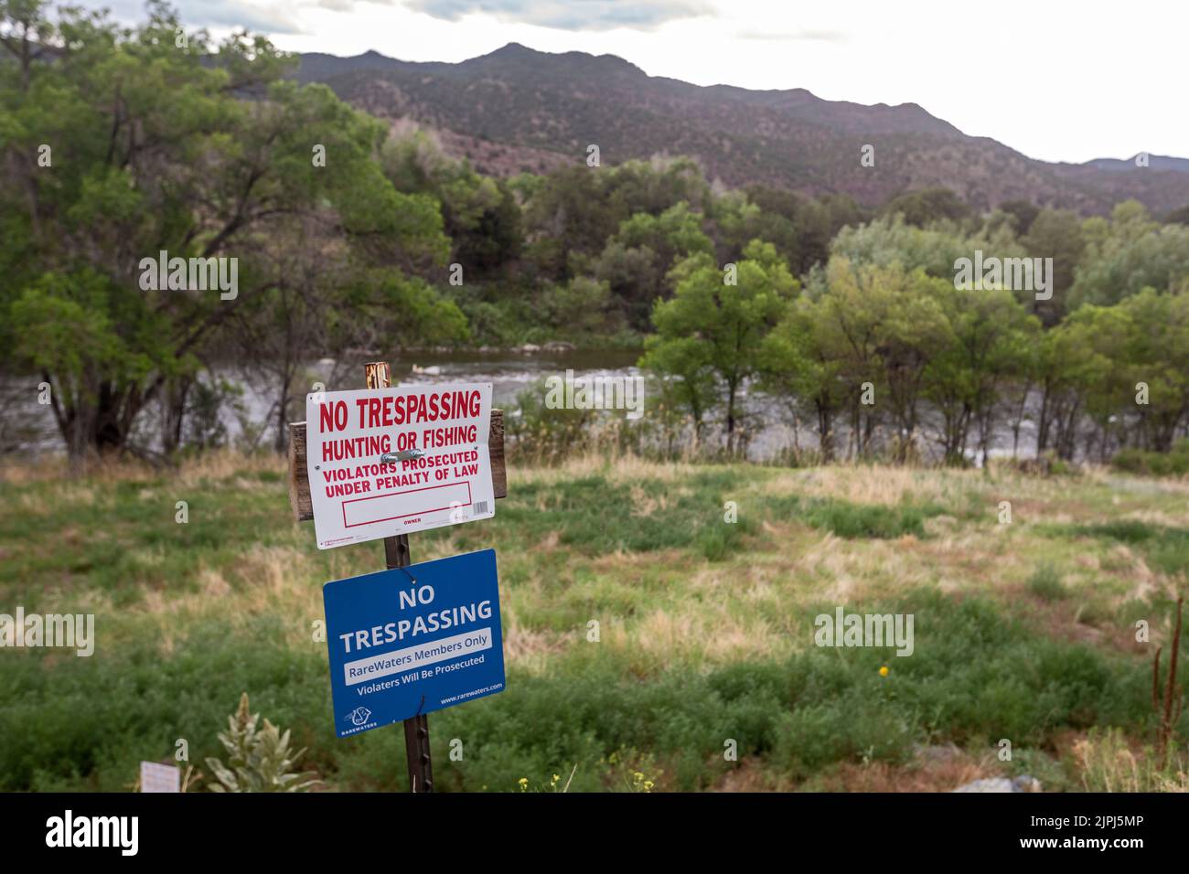 Salida, Colorado - Signs on the banks of the Arkansas River forbid fishing and other activities along or in the river. Private landowners along the Ar Stock Photo