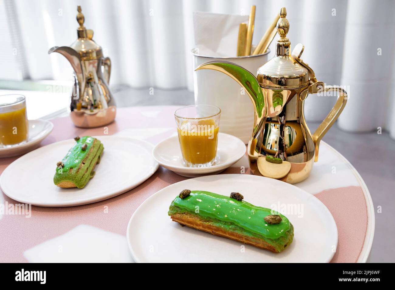 Pistachio eclair and arabic coffee at specialist Middle Eastern Bafarat