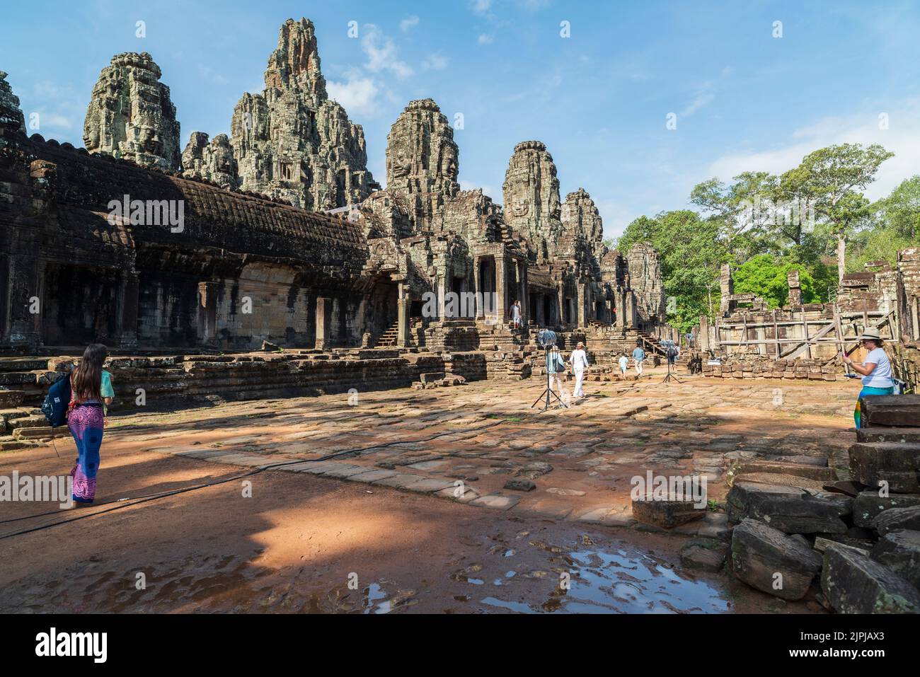 Angkor Wat Temple Complex. Siem Reap City is a historical touristy place in Cambodia. The ancient stone faces of Bayon temple. Stock Photo