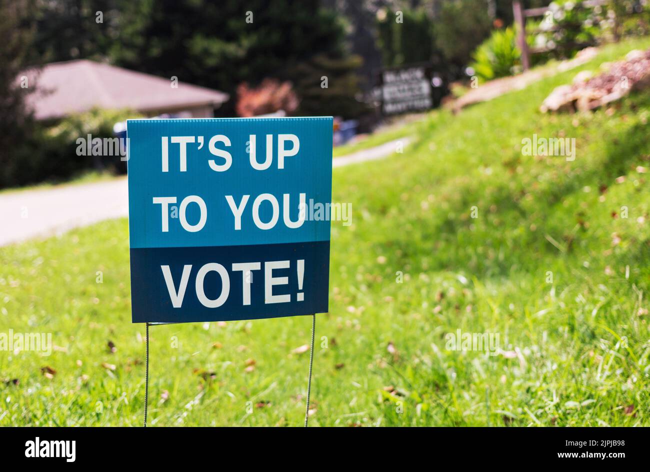 A sign in a front yard says, It's up to you--vote!' Stock Photo