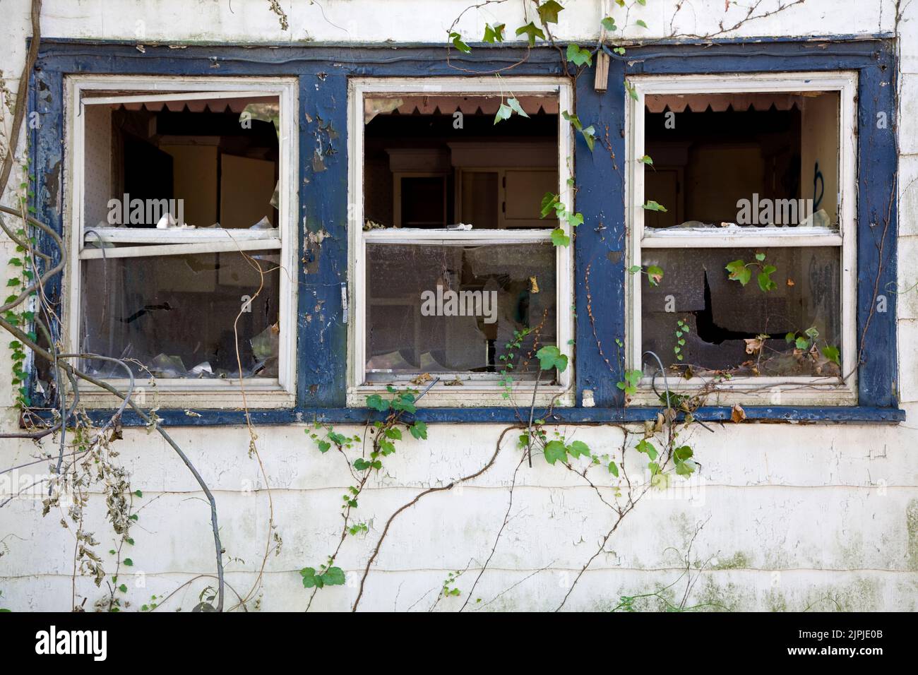 Abandoned house broken windows Stock Photo
