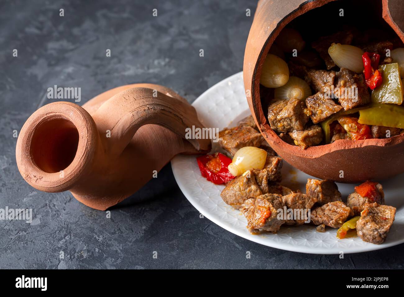 Authentic Turkish Testi Kebab cooked in earthenware waterjug, Turkish name; Testi kebabi Stock Photo