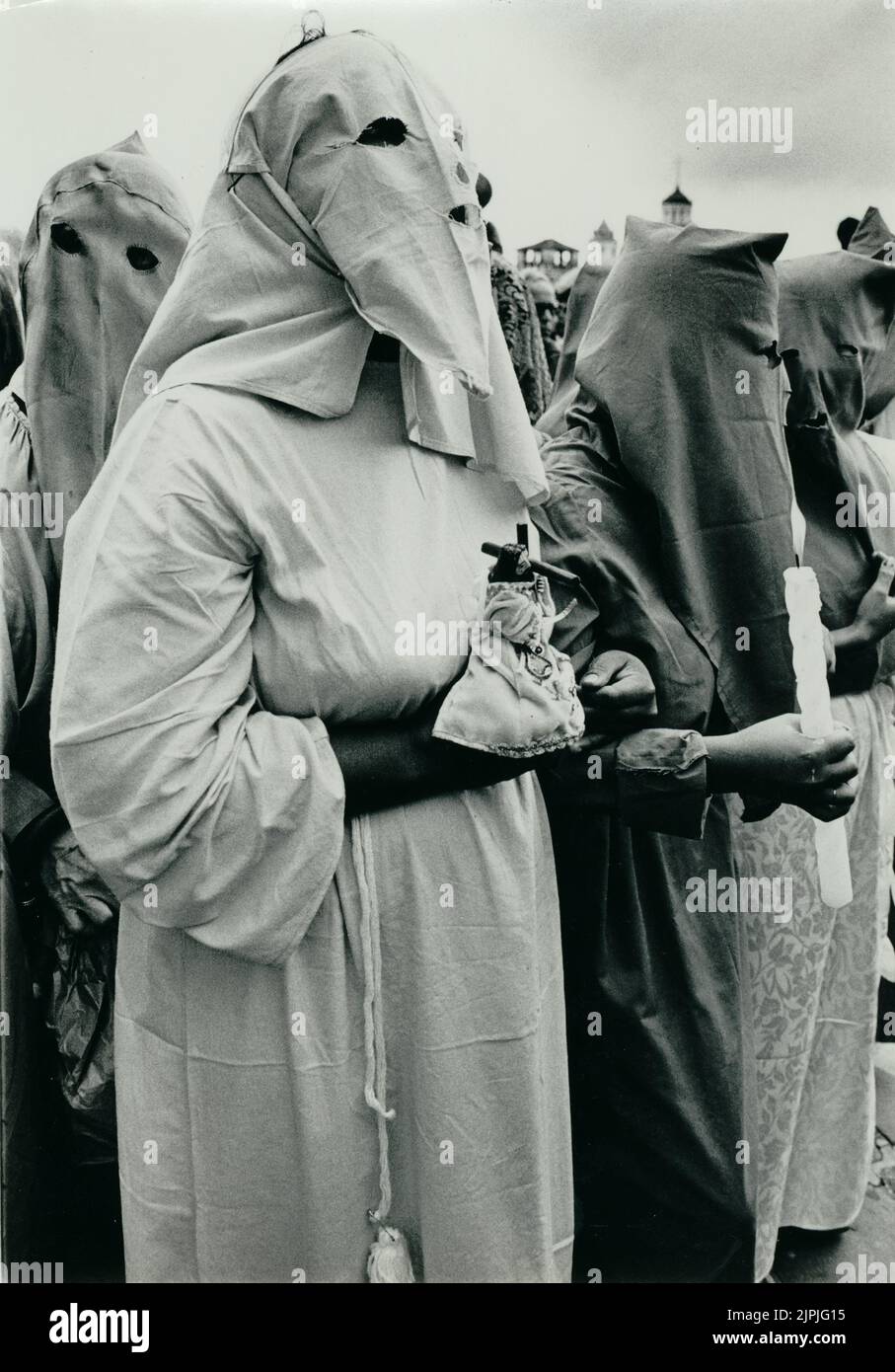 Robed penitents taking part in an Easter Holy Week or Semana Santa procession in Quito, Ecuador Stock Photo