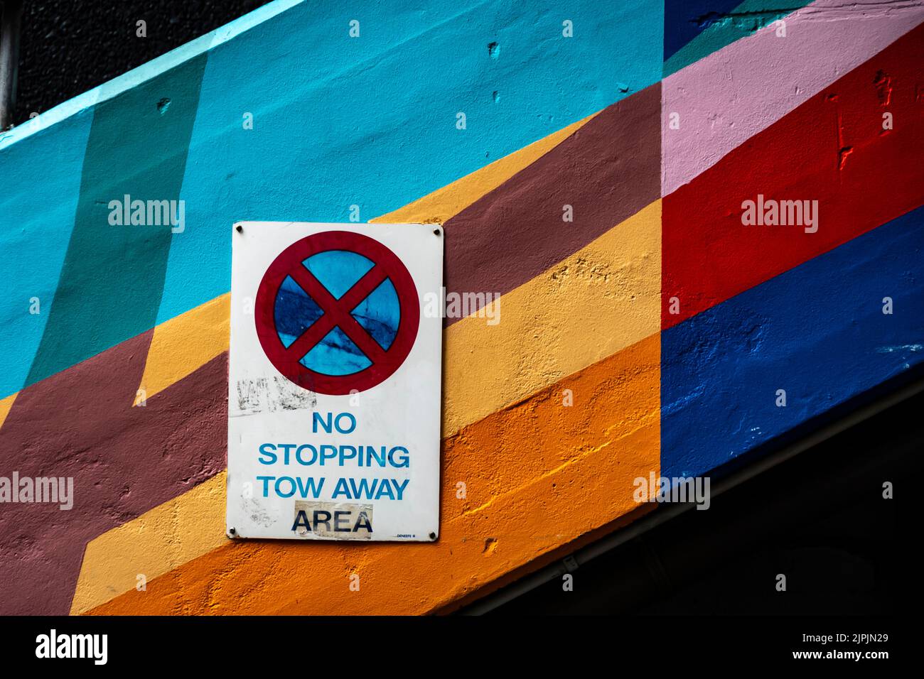 No stopping sign on coloured wall, Wellington, North Island, New Zealand Stock Photo
