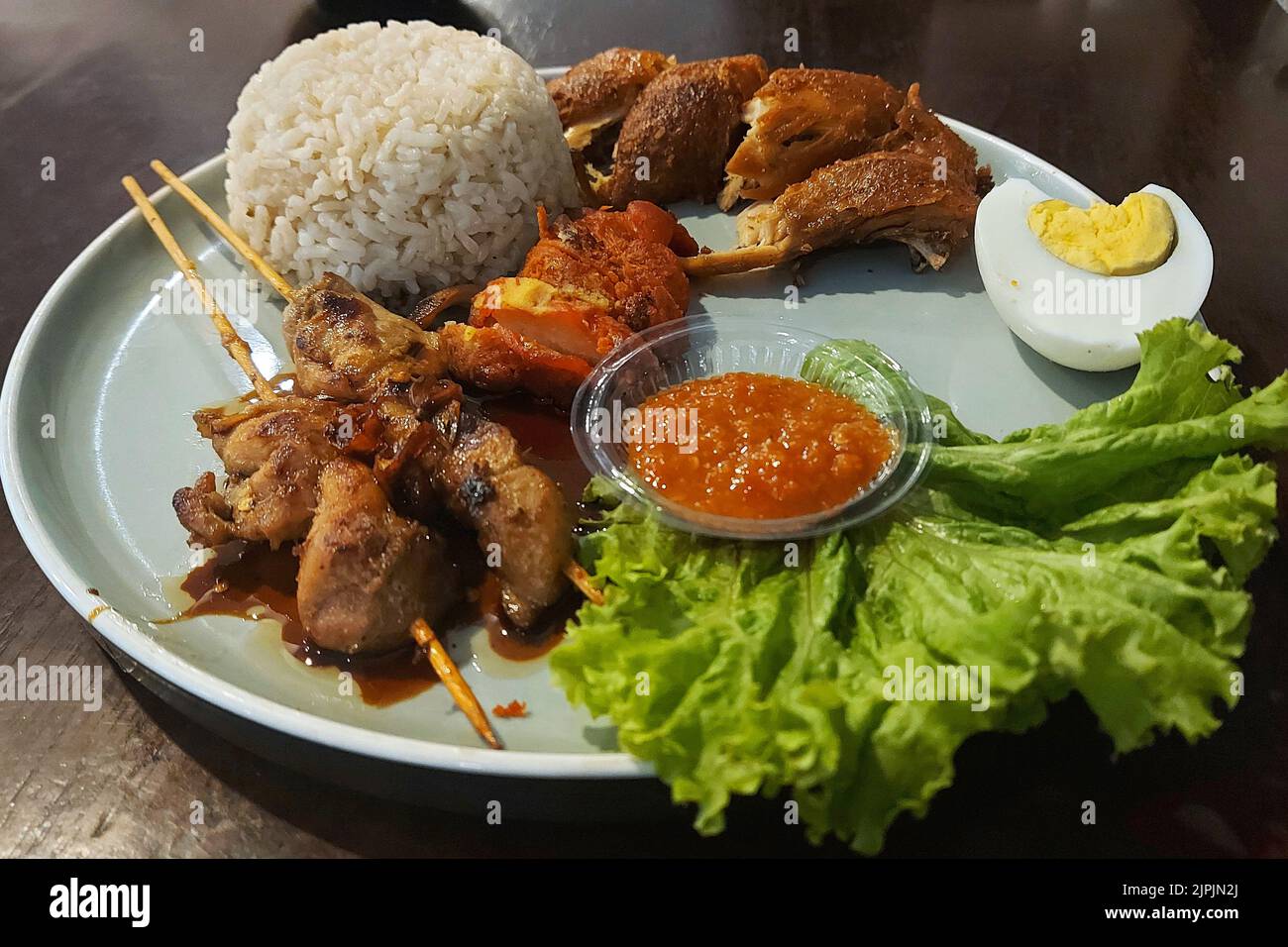Nasi Campur, Mix Rice, traditional Food, at Cafe Jakarta, Indonesia Stock Photo