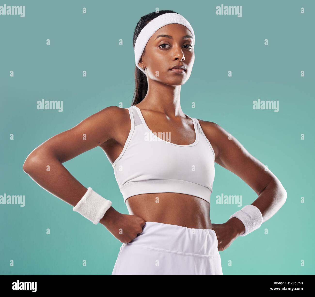 Wellness, fitness and power by a confident athletic woman serious about her health and body goals. Portrait of a gym trainer or coach with an Stock Photo